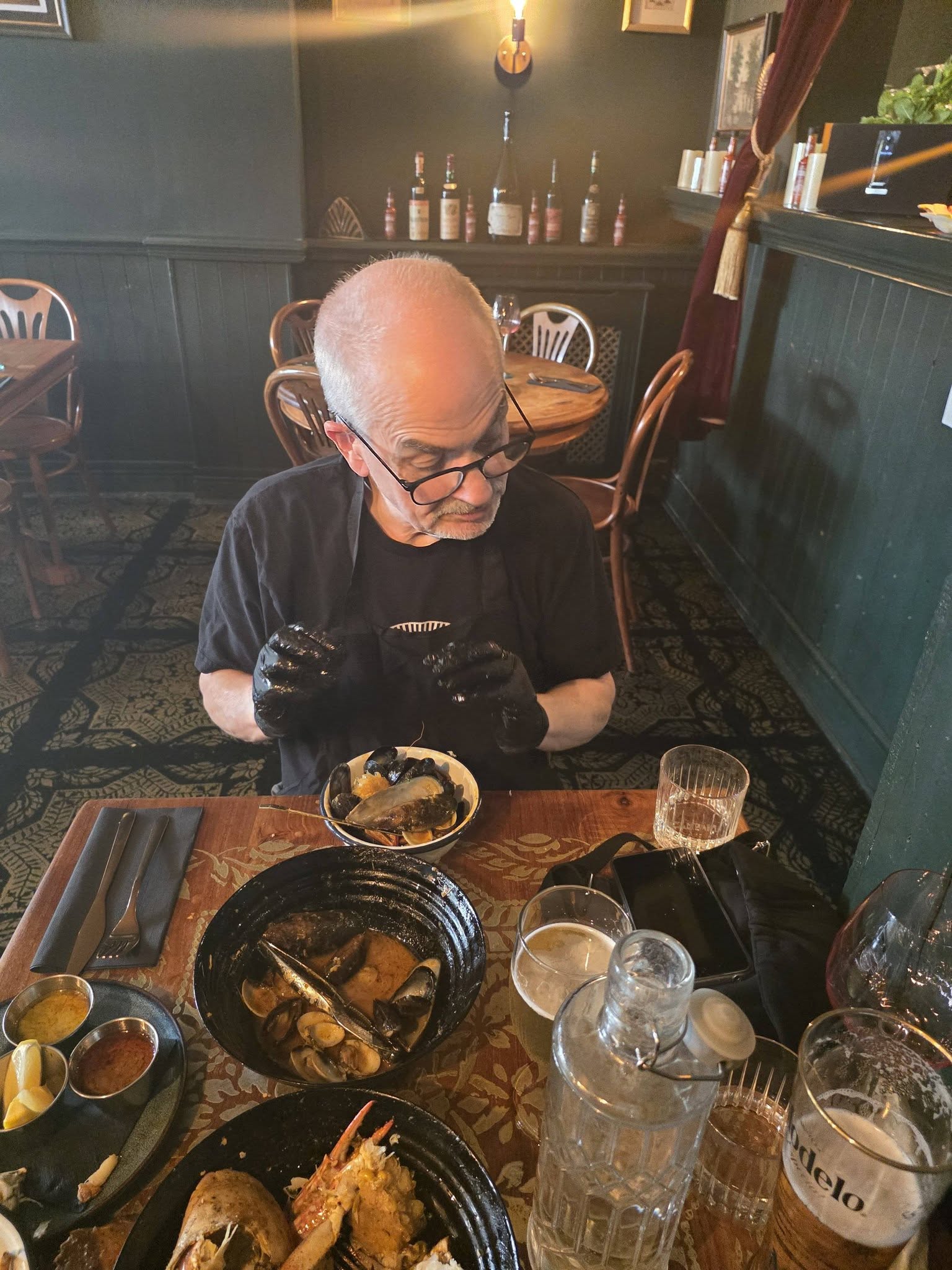 Enjoying the mussels from the seafood boil with passion