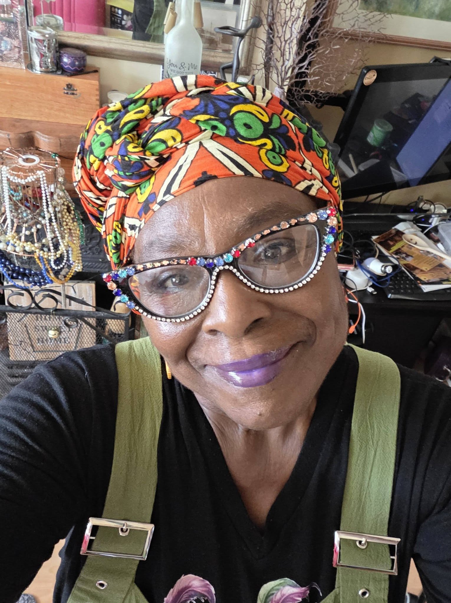 Momma Cherri smiling brightly, ready for what's coming next