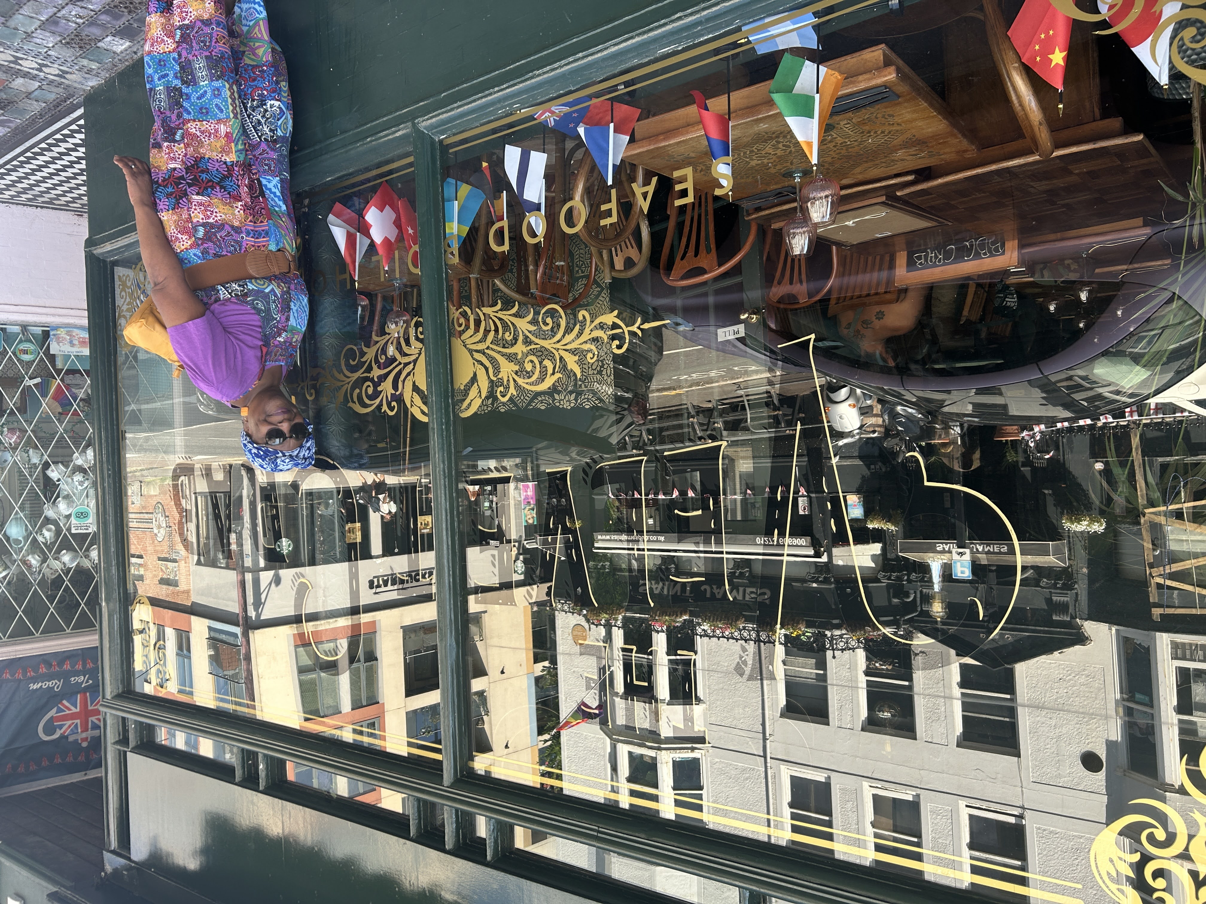 The Velvet Crab storefront in Brighton with green and gold exterior